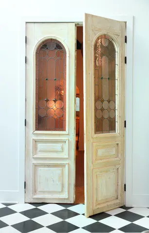 a bedroom with furniture and a mirror