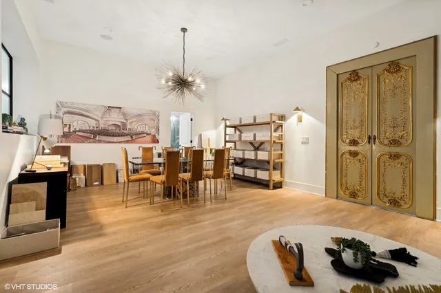 a dining room with furniture and window