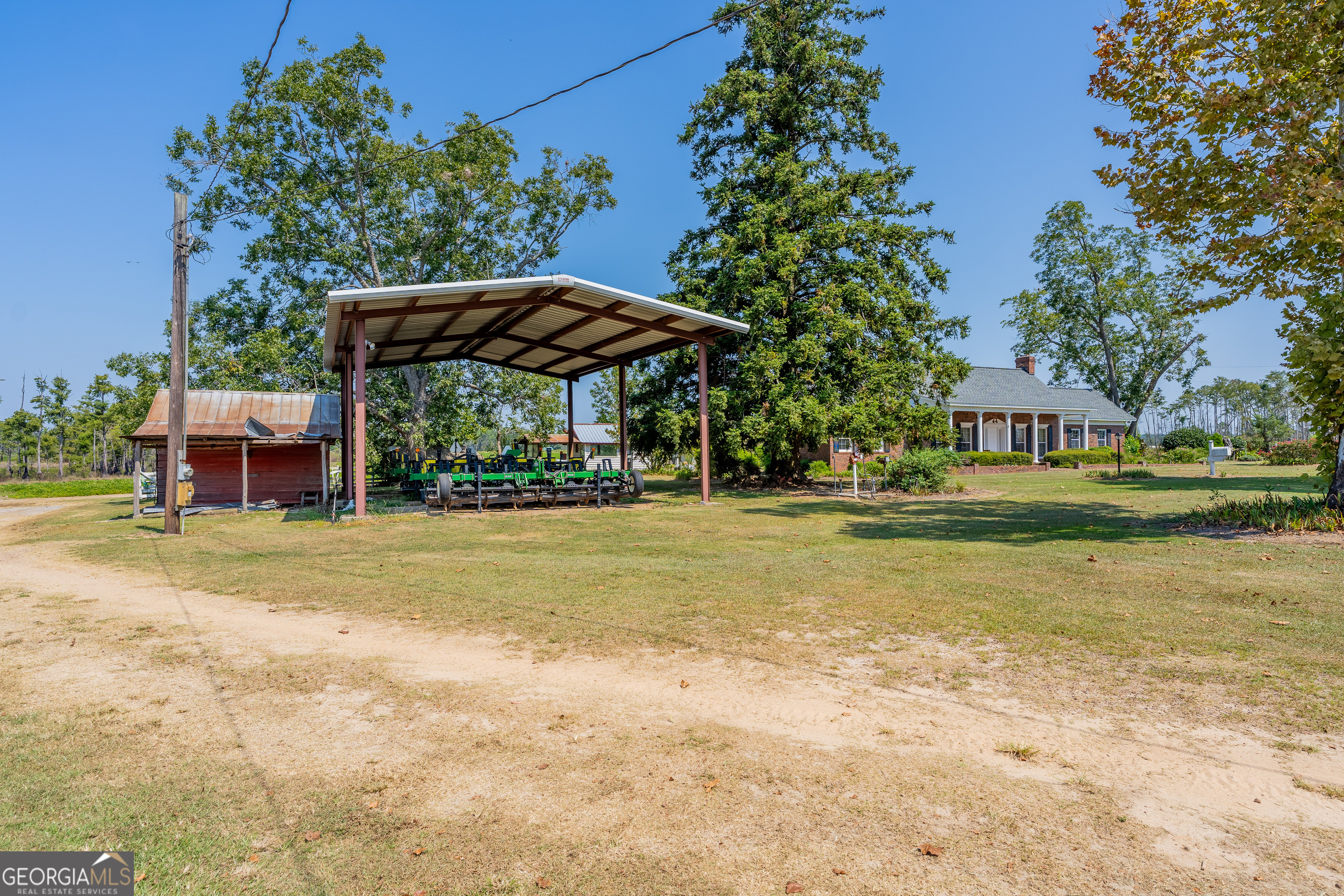 1671 Warren Carter Road Douglas, GA 31533 - Photo 12 of 57 a view of a swimming pool with a patio