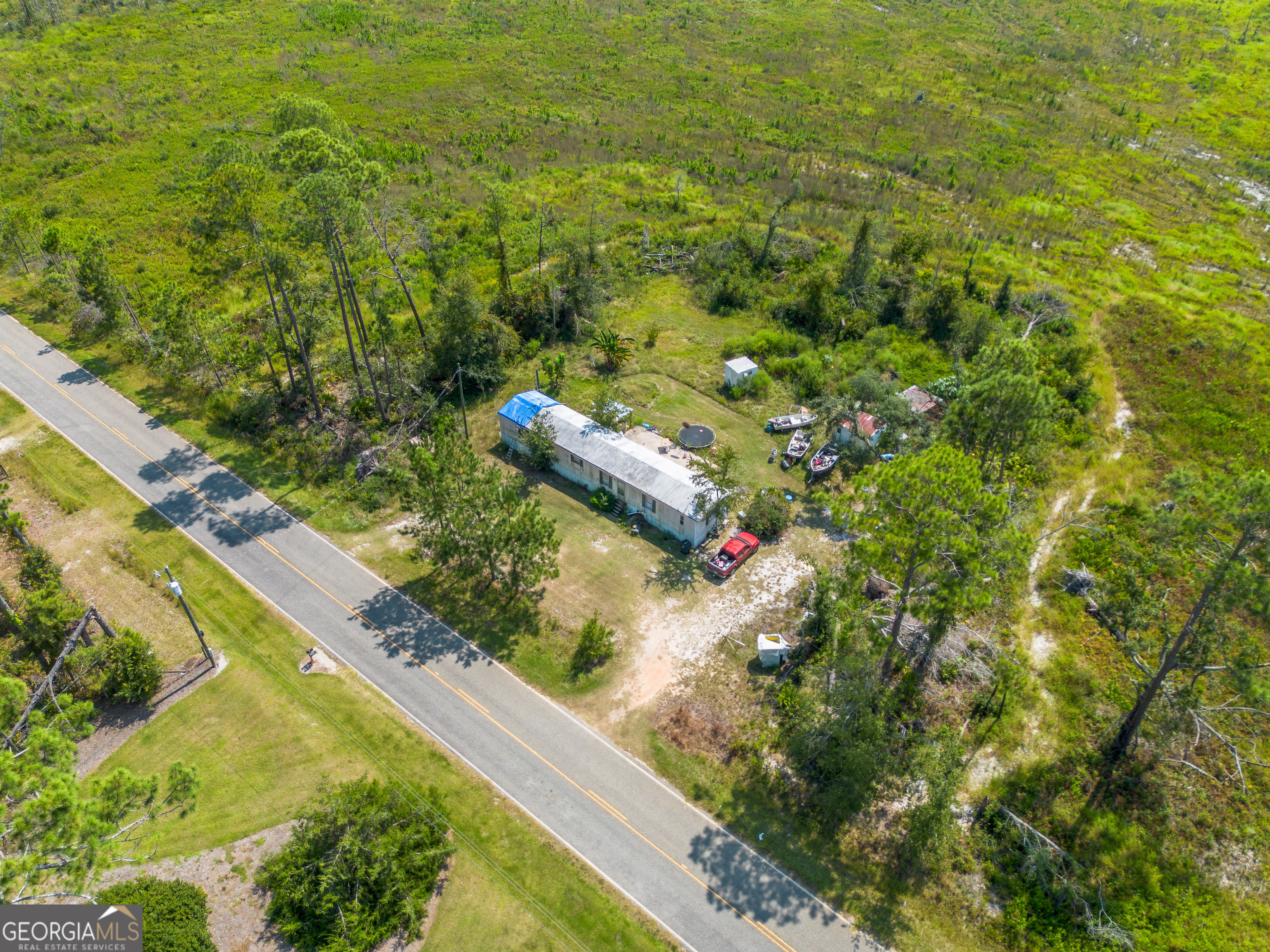 1671 Warren Carter Road Douglas, GA 31533 - Photo 22 of 57 a view of a yard with plants