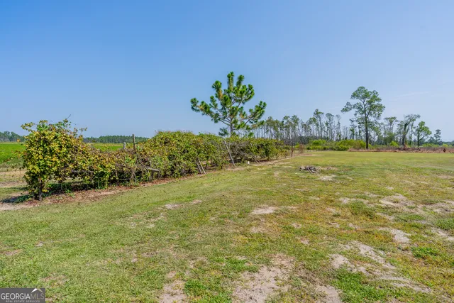 a view of a lake with a big yard