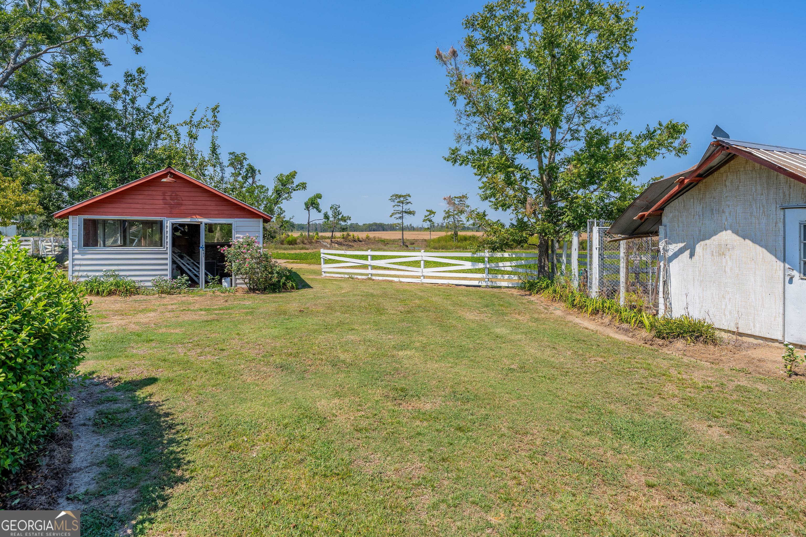 1671 Warren Carter Road Douglas, GA 31533 - Photo 27 of 57 a view of a house with a yard and sitting area
