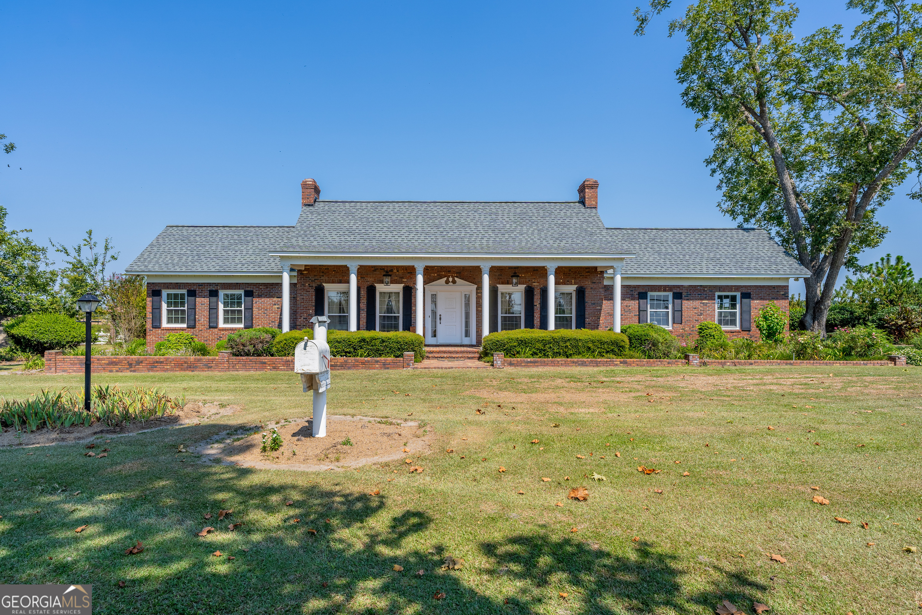 1671 Warren Carter Road Douglas, GA 31533 - Photo 3 of 57 a front view of a house with a yard