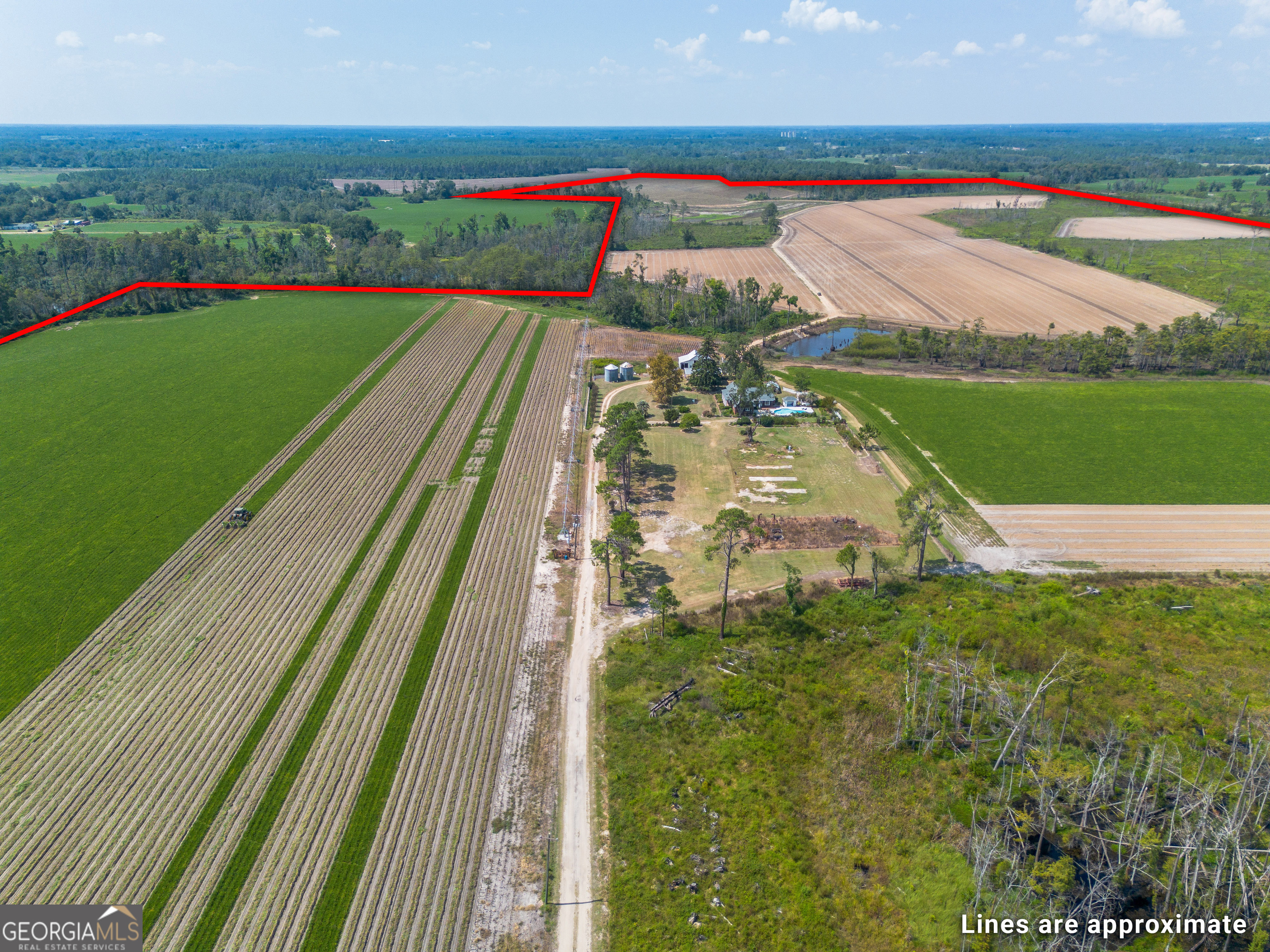 1671 Warren Carter Road Douglas, GA 31533 - Photo 31 of 57 a view of a lake with a big yard