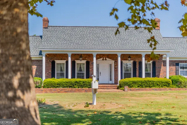 a kitchen with stainless steel appliances granite countertop a stove and cabinets