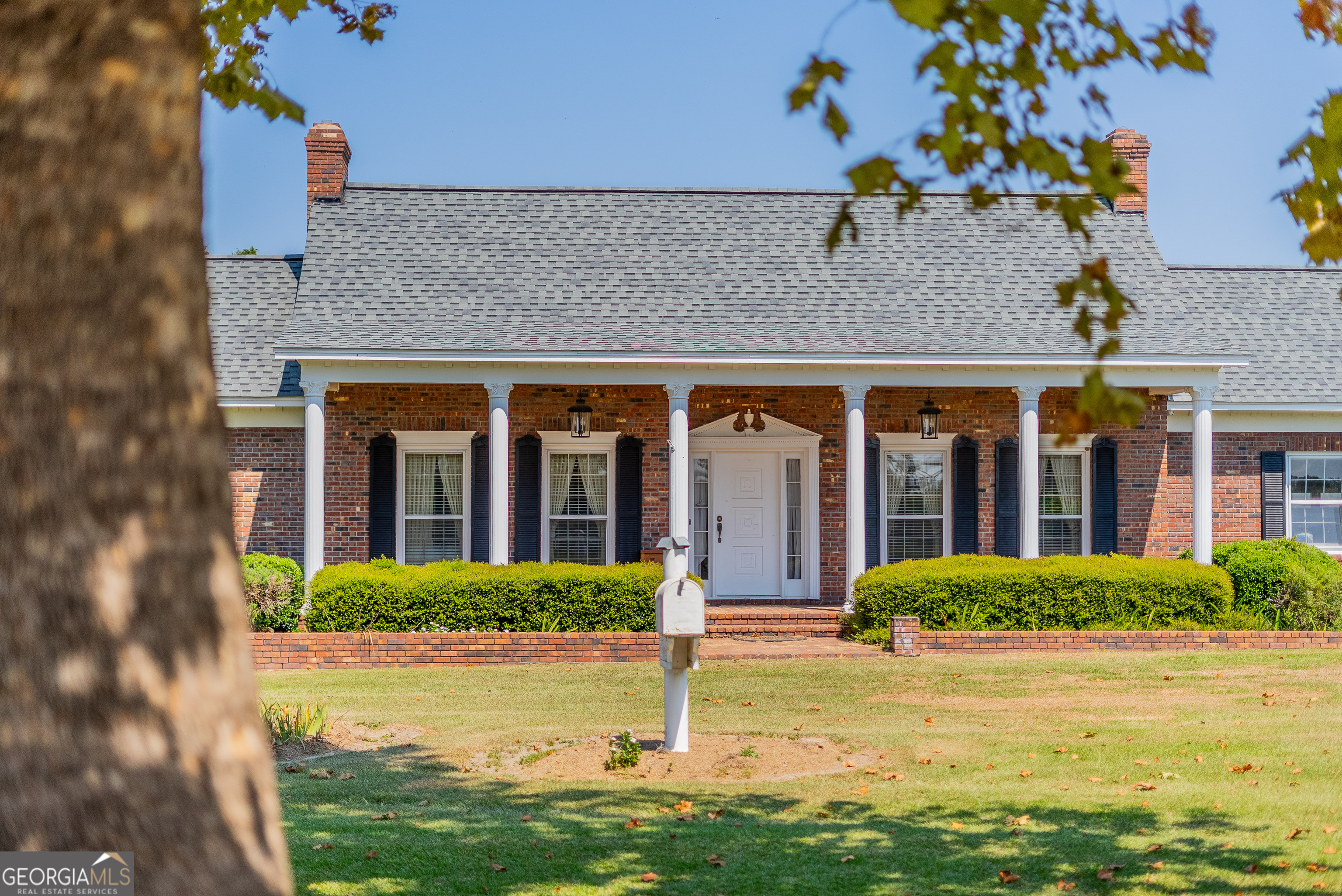 1671 Warren Carter Road Douglas, GA 31533 - Photo 32 of 57 a front view of a house with garden