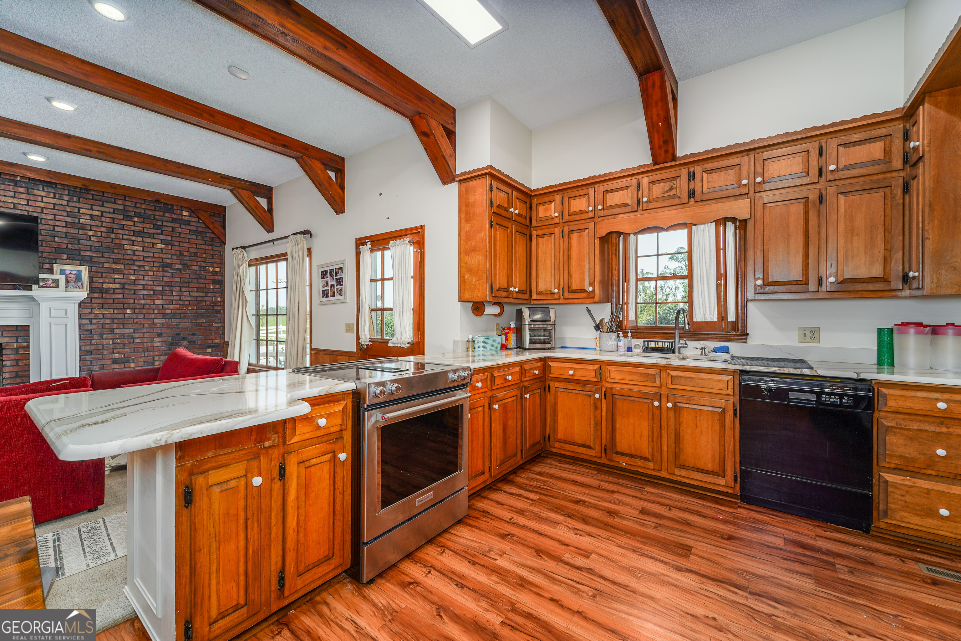 1671 Warren Carter Road Douglas, GA 31533 - Photo 39 of 57 a kitchen with stainless steel appliances granite countertop a stove and cabinets