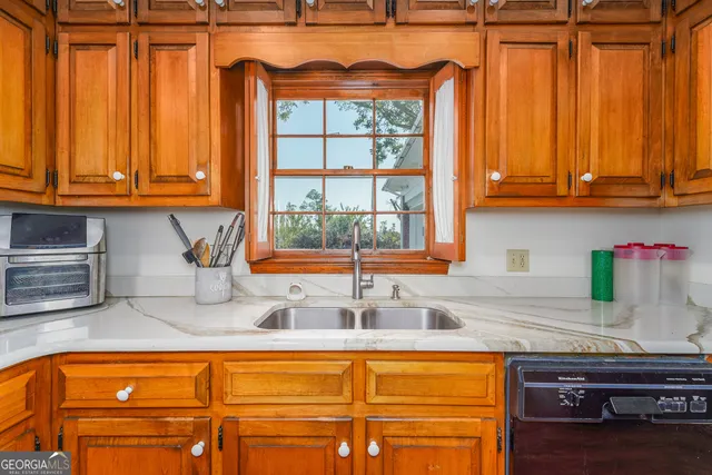 a bathroom with a toilet and a shower curtain