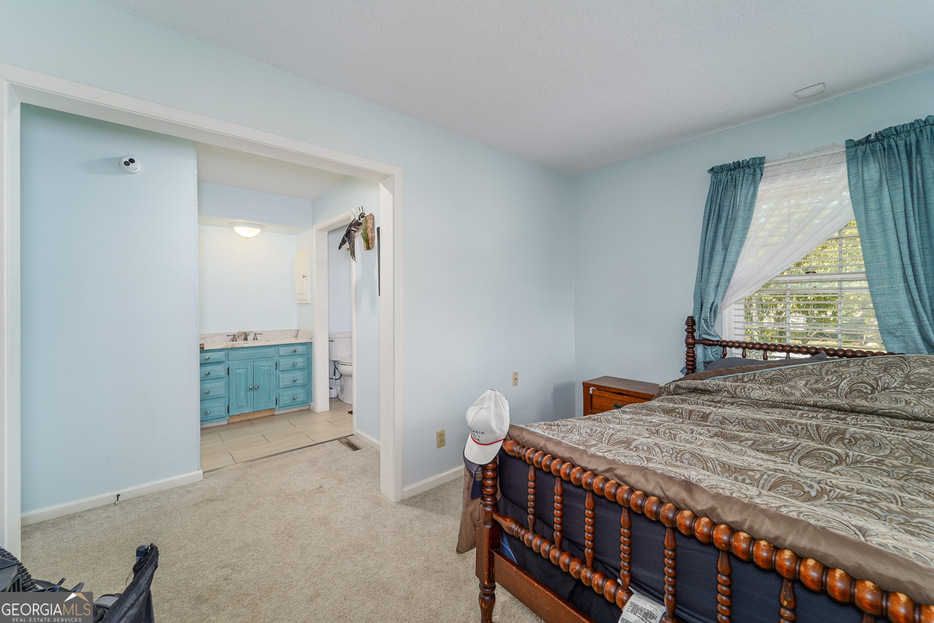 1671 Warren Carter Road Douglas, GA 31533 - Photo 42 of 57 a bedroom with a bed and a window