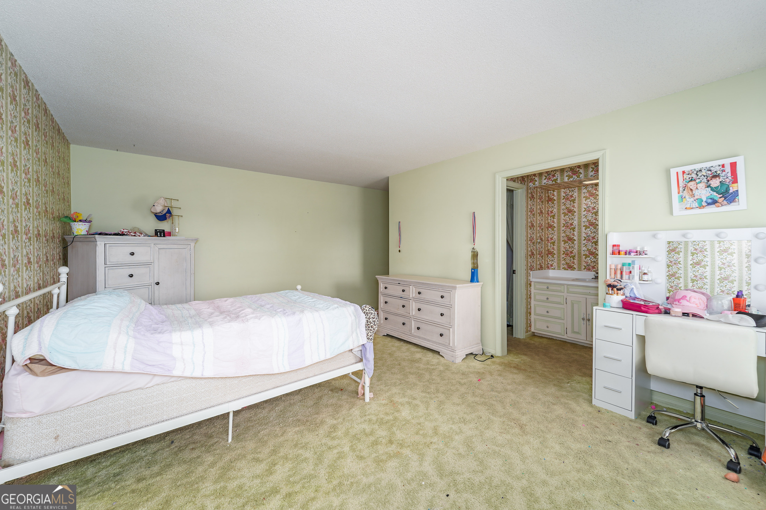 1671 Warren Carter Road Douglas, GA 31533 - Photo 46 of 57 a bedroom with a bed and a desk