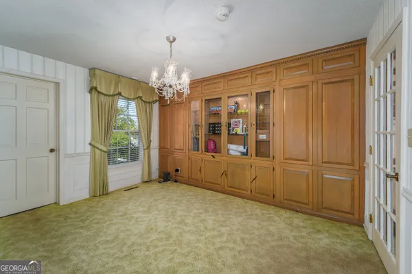 a view of an empty room with a fireplace