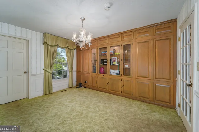 a view of an empty room with a fireplace