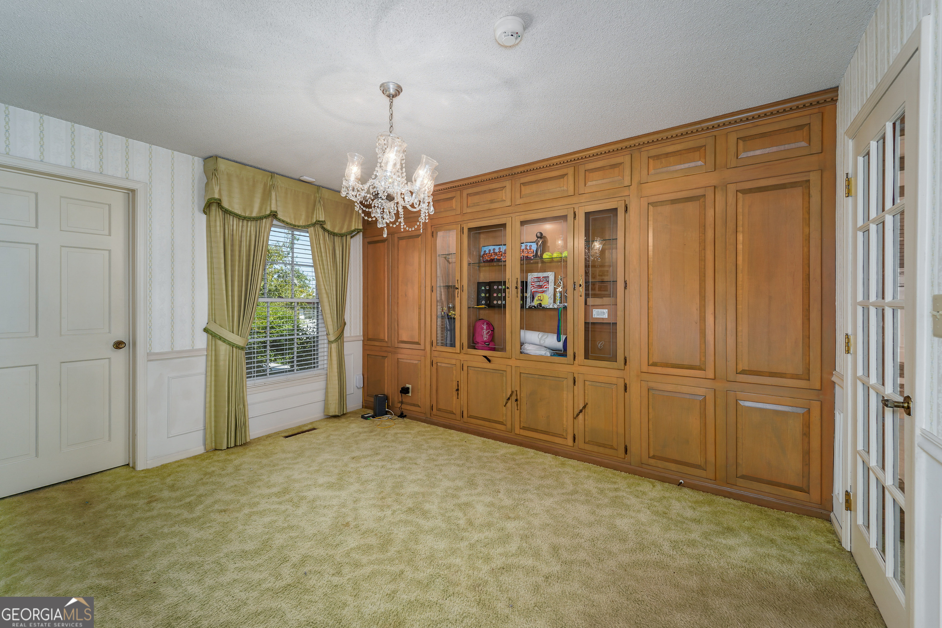 1671 Warren Carter Road Douglas, GA 31533 - Photo 49 of 57 wooden floor in an empty room with a window