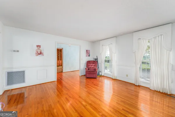 a bathroom with a bathtub and a toilet