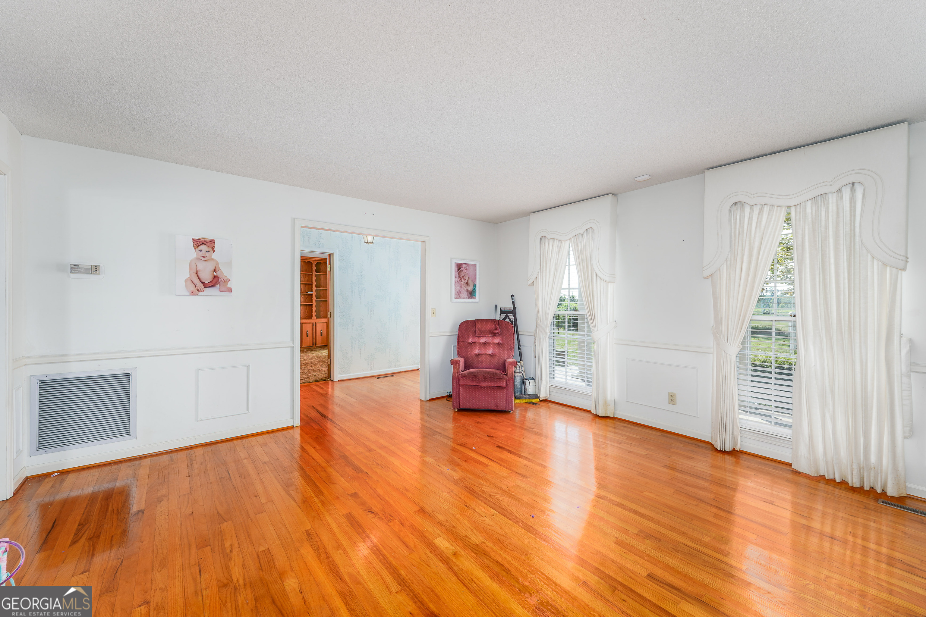 1671 Warren Carter Road Douglas, GA 31533 - Photo 50 of 57 a view of empty room with wooden floor