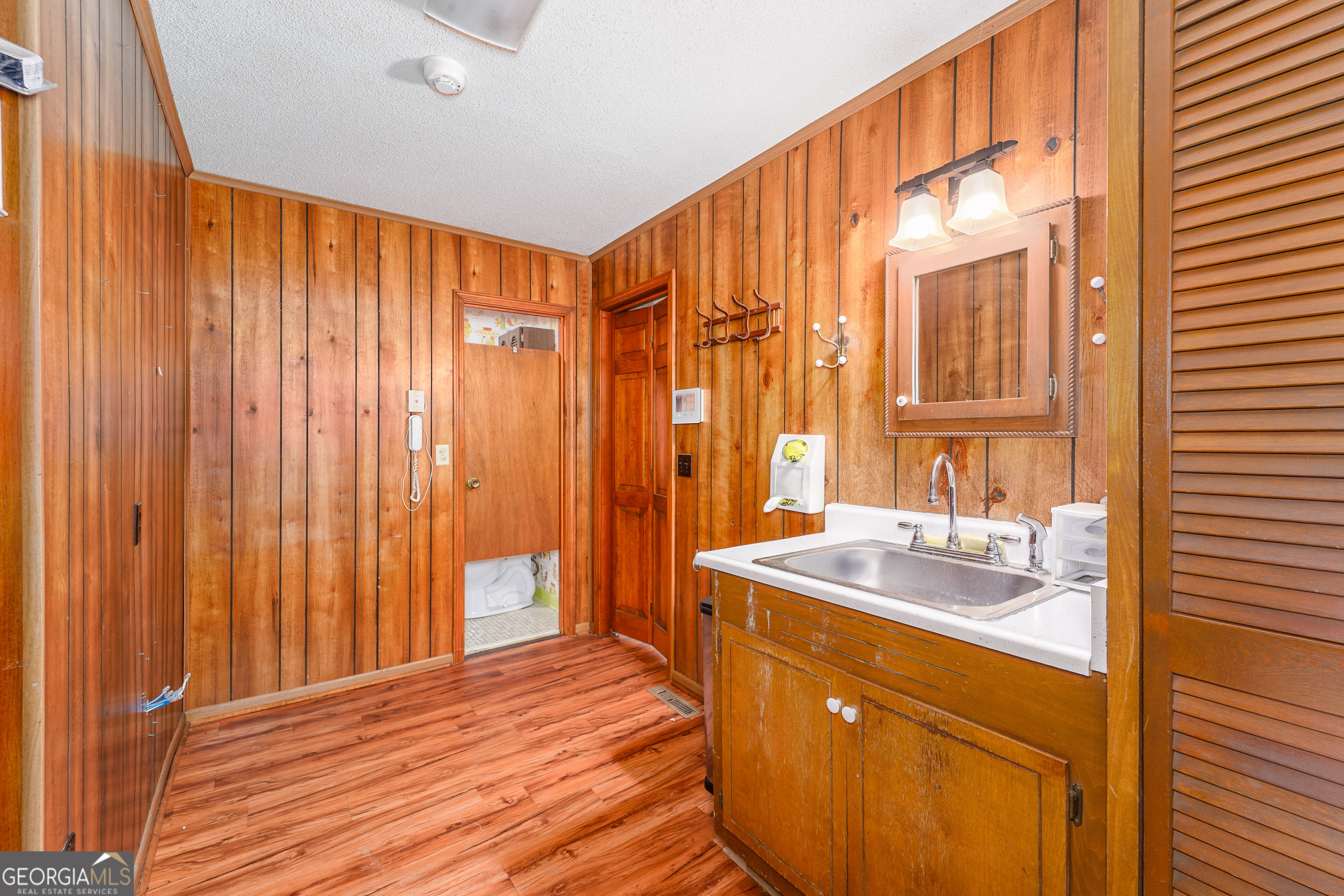 1671 Warren Carter Road Douglas, GA 31533 - Photo 53 of 57 a bathroom with a sink and a mirror