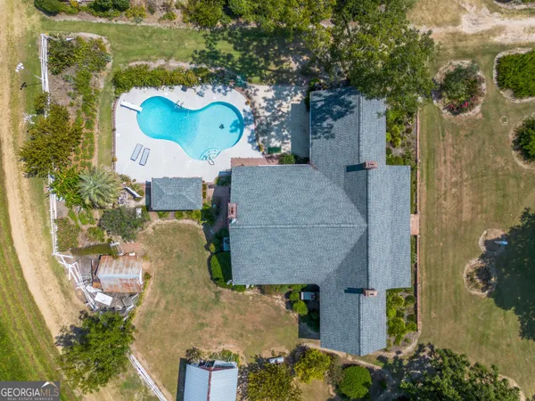 an aerial view of houses with outdoor space