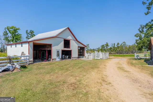 a view of house with outdoor space and swimming pool