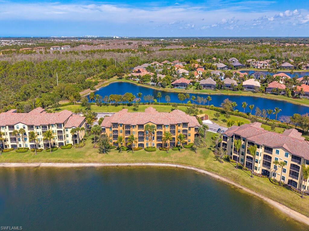 9731 Acqua Court, Unit 514 Naples, FL 34113 - Photo 20 of 21 Drone / aerial view of a nearby body of water