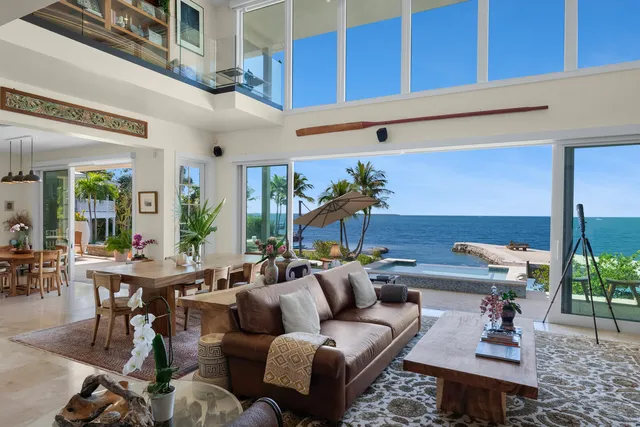 a view of entryway livingroom and hall with wooden floor