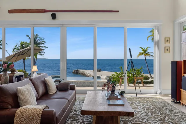 a bedroom with a bed a couch and dresser