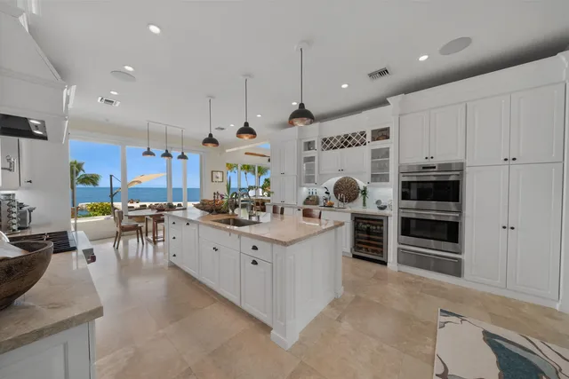 a lobby with furniture and potted plants