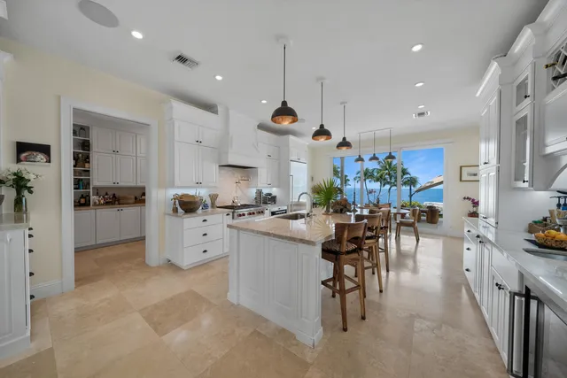 a view of a house with swimming pool and sitting area