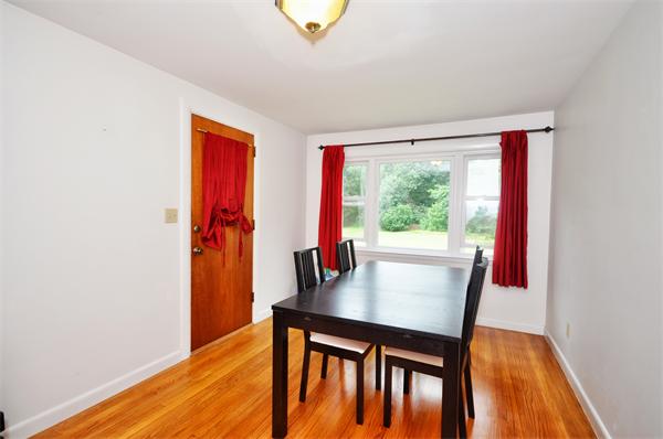 135 Flagg Hill Road Boxborough, MA 01719 - Photo 5 of 13 a dining room with furniture and wooden floor