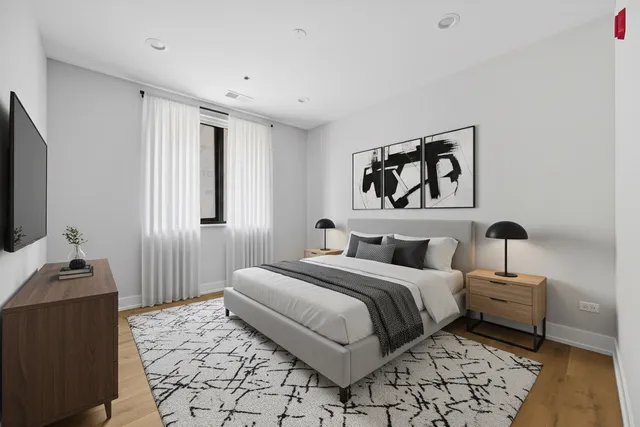 a bedroom with a bed and a couch