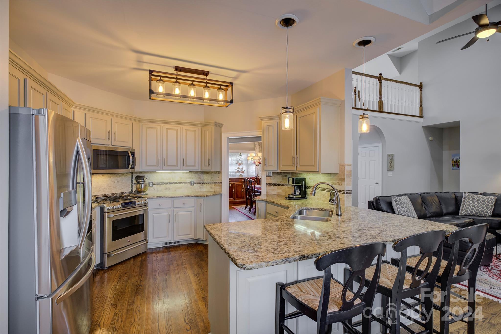 125 Clearview Road Rock Hill, SC 29732 - Photo 11 of 48 a kitchen with a refrigerator a stove a sink dishwasher with a dining table and chairs