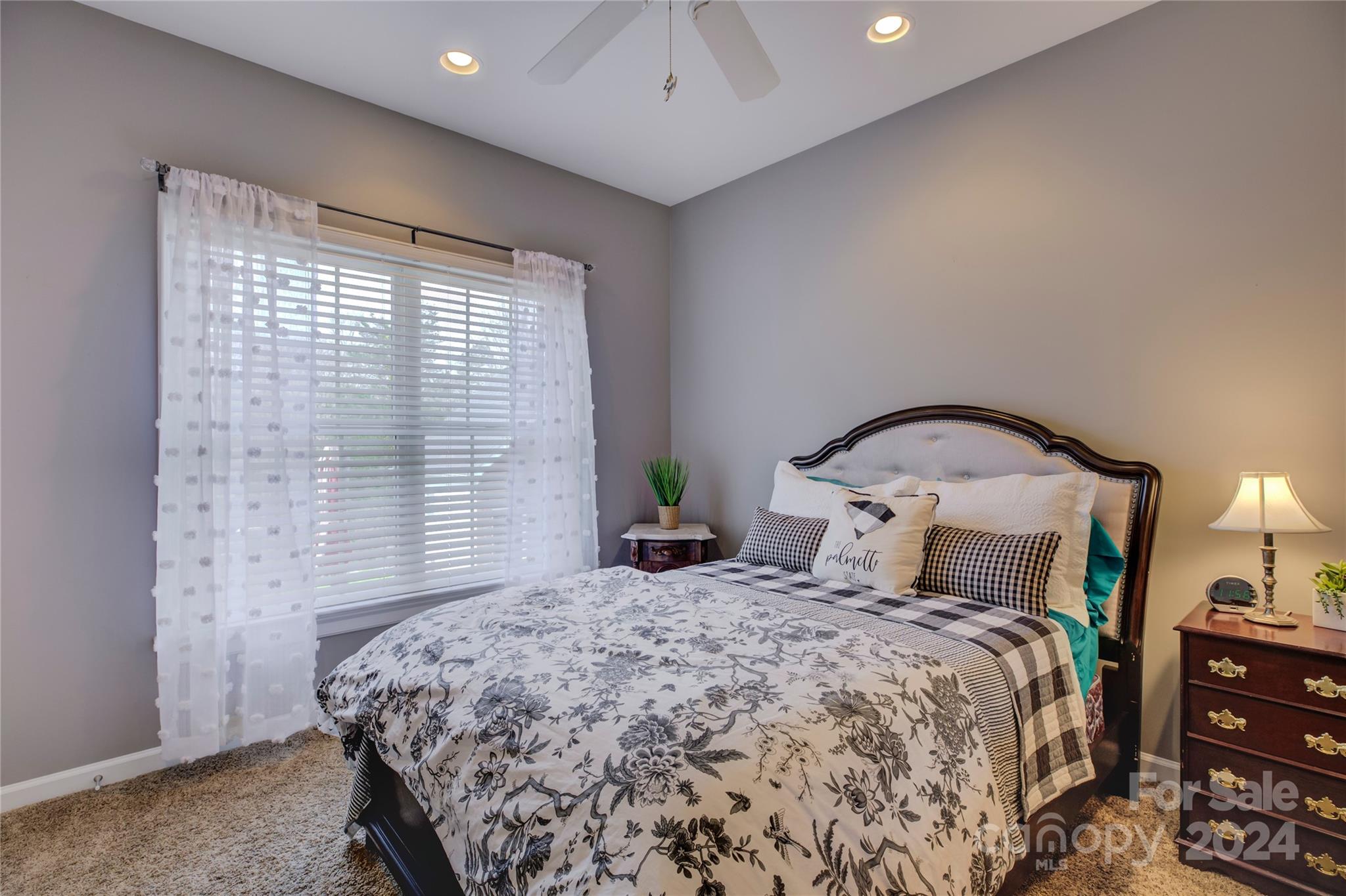 125 Clearview Road Rock Hill, SC 29732 - Photo 23 of 48 a bedroom with a bed and a chandelier