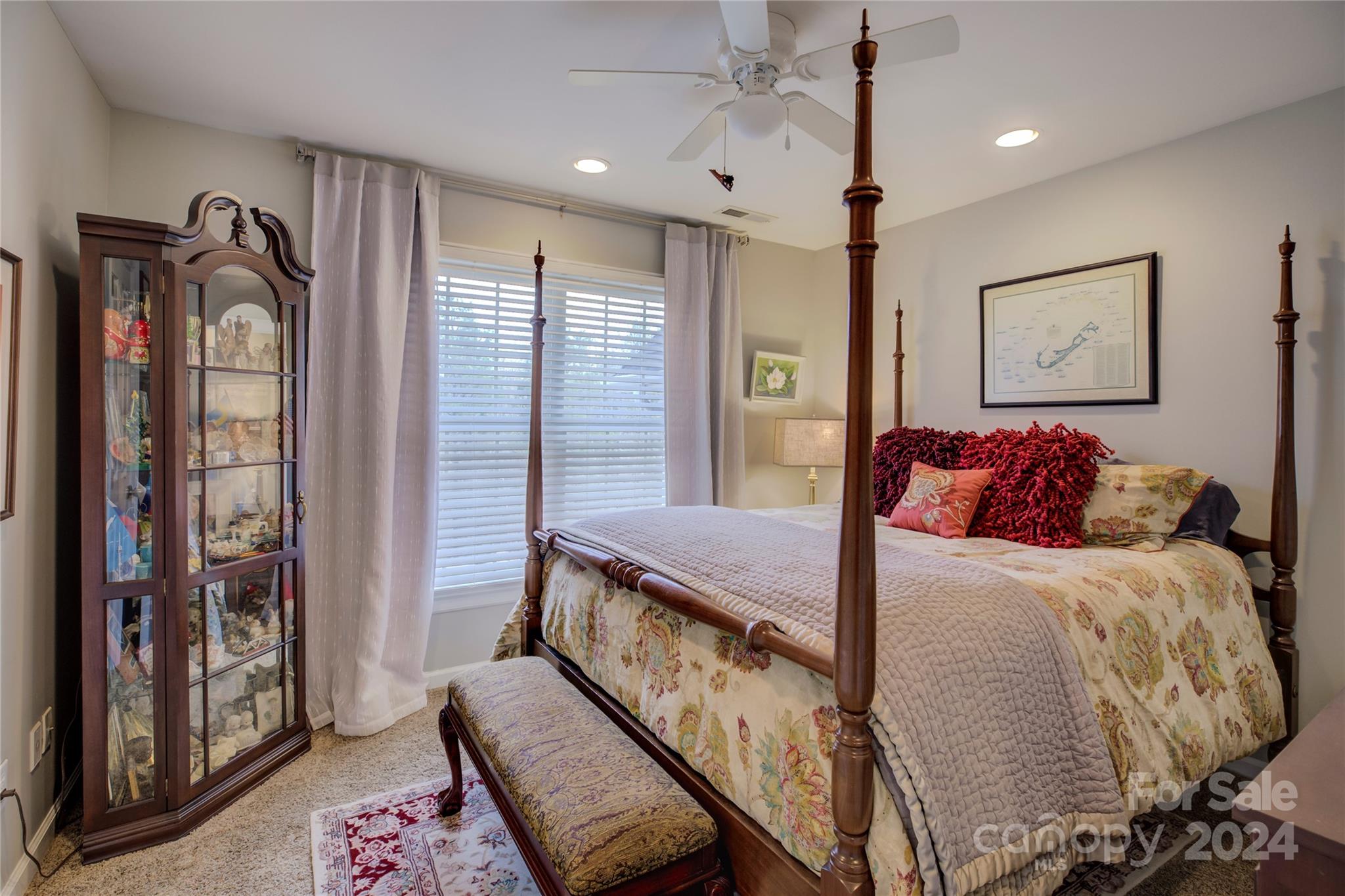 125 Clearview Road Rock Hill, SC 29732 - Photo 28 of 48 a bedroom with a large bed and a chandelier