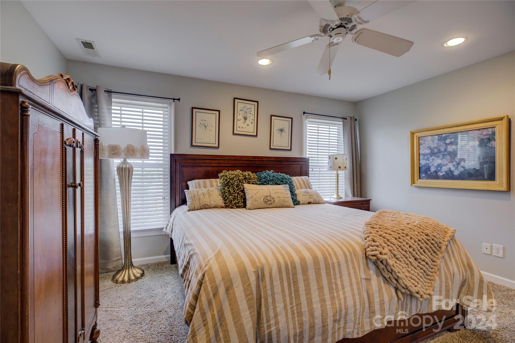 125 Clearview Road Rock Hill, SC 29732 - Photo 32 of 48 a bedroom with a large bed and a chandelier