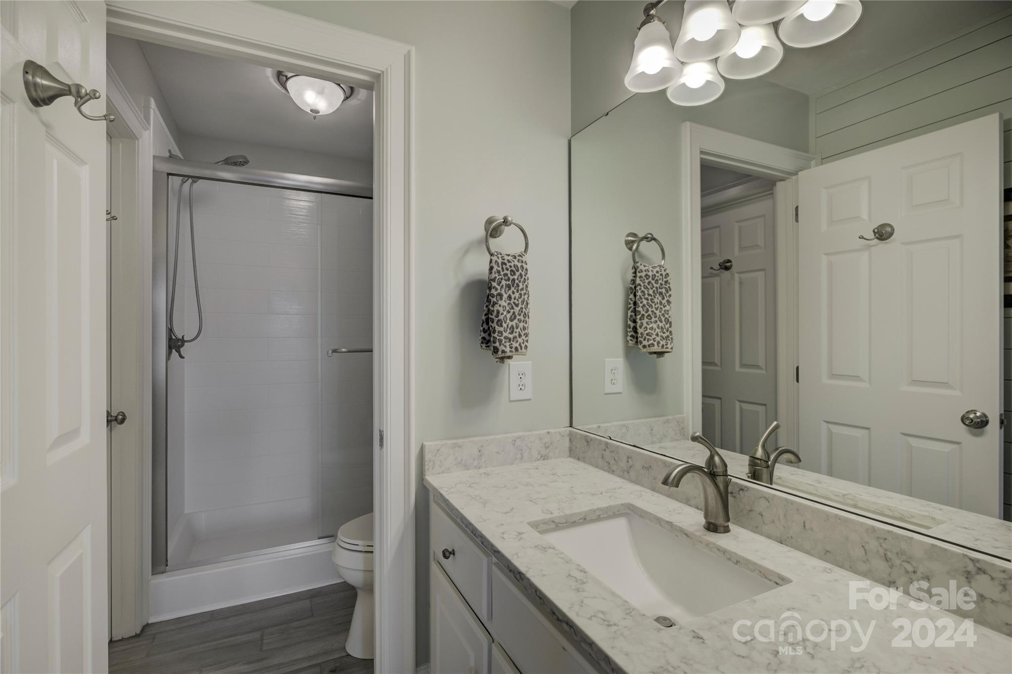 125 Clearview Road Rock Hill, SC 29732 - Photo 33 of 48 a bathroom with a granite countertop sink a toilet a mirror and shower