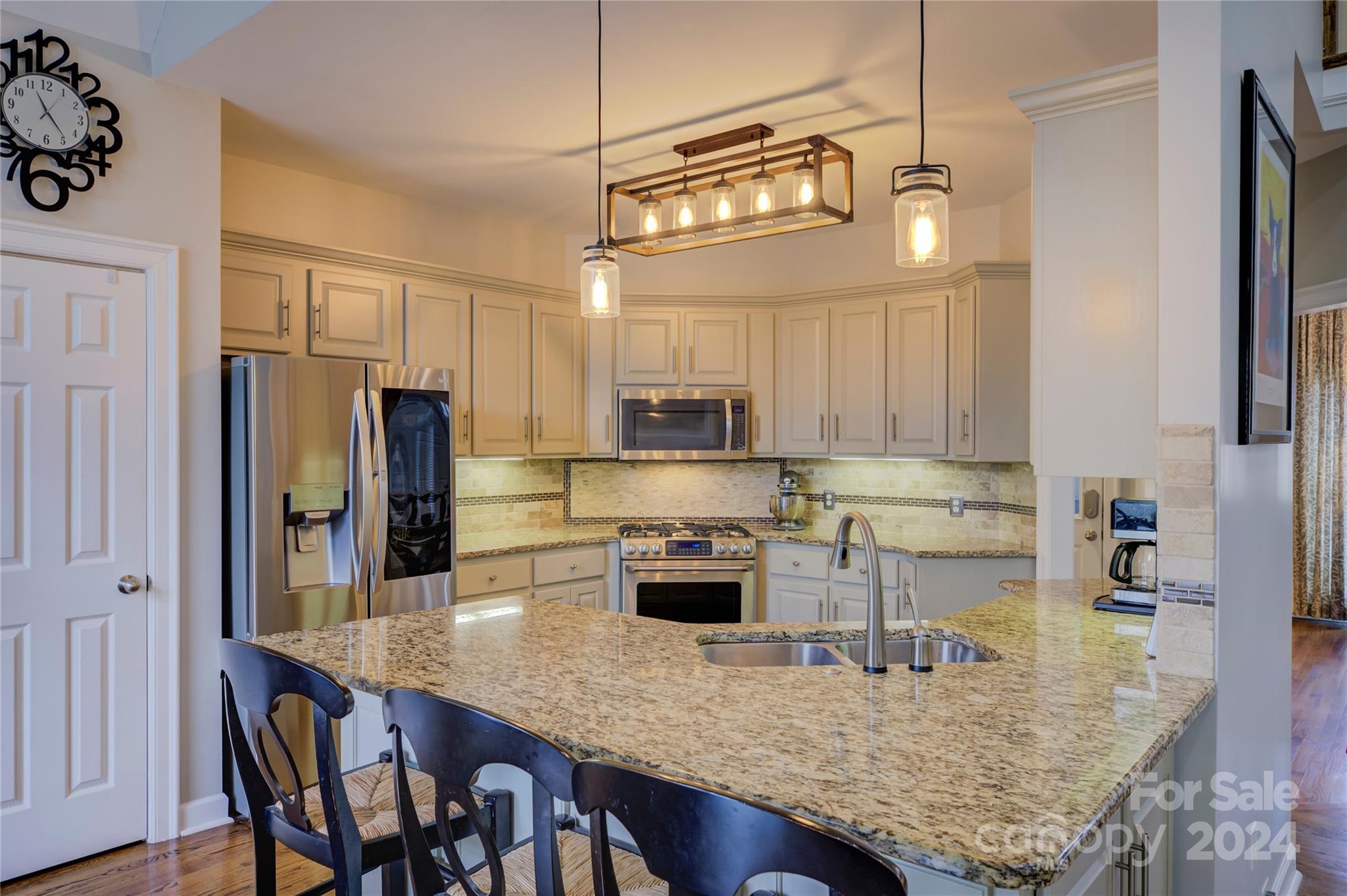 125 Clearview Road Rock Hill, SC 29732 - Photo 10 of 48 a kitchen with stainless steel appliances granite countertop a sink refrigerator and cabinets