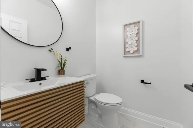 a room with a bed and a view of bathroom