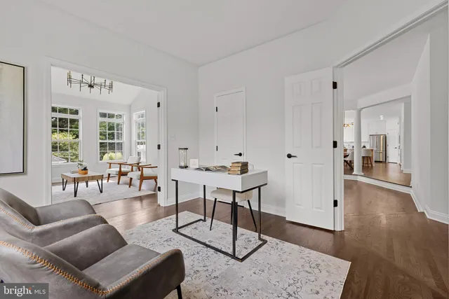 a view of staircase with railing and a chandelier