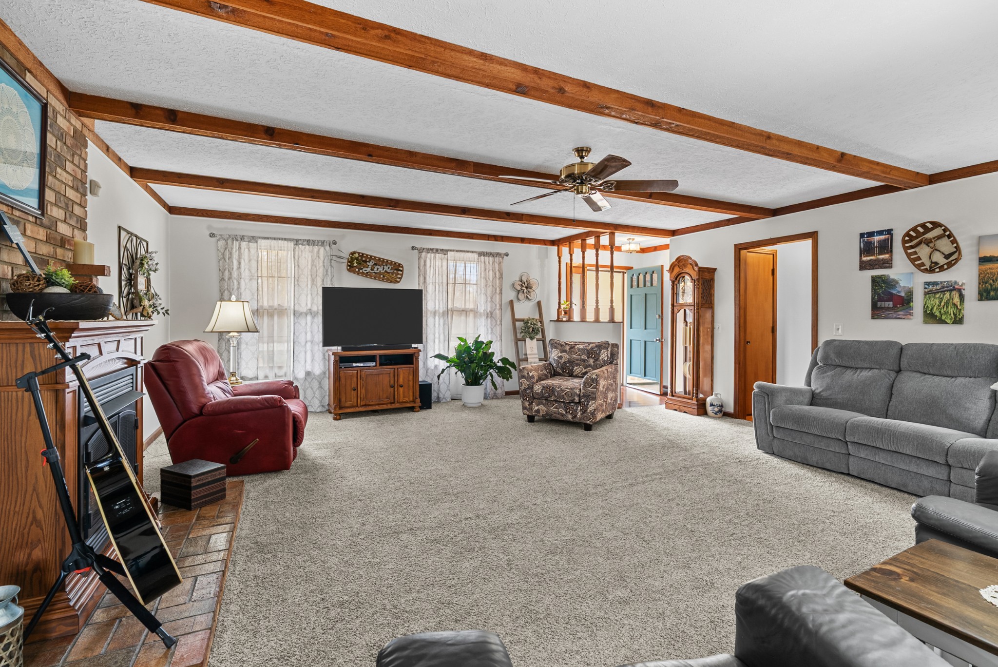 6980 Bethel Road Greenbrier, TN 37073 - Photo 11 of 51 a living room with furniture and a flat screen tv