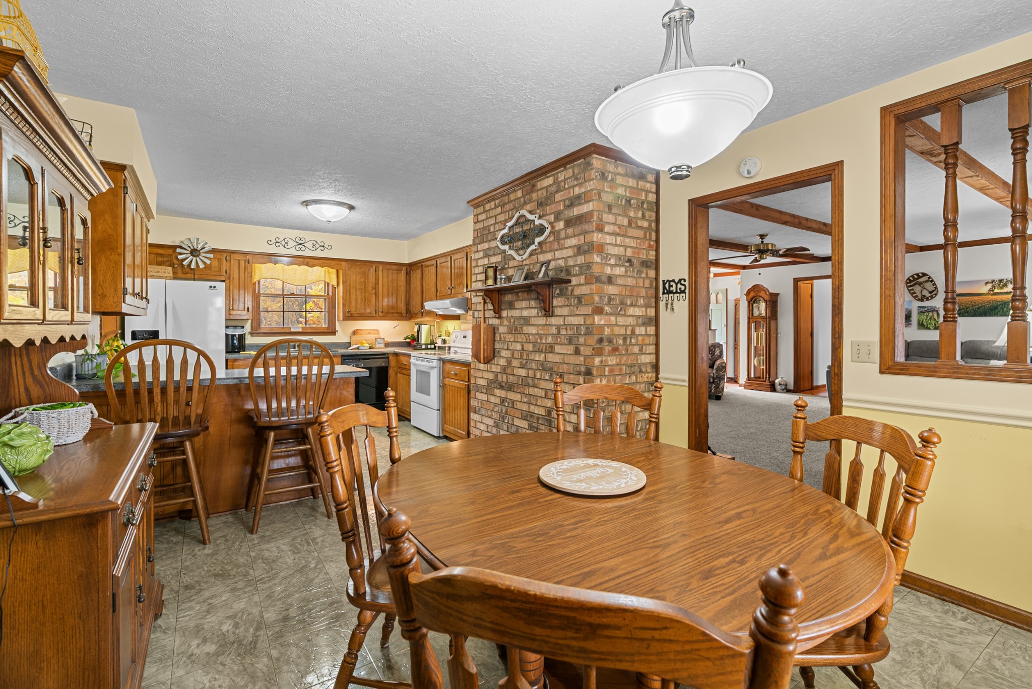 6980 Bethel Road Greenbrier, TN 37073 - Photo 13 of 51 a view of a dining room with furniture and chandelier