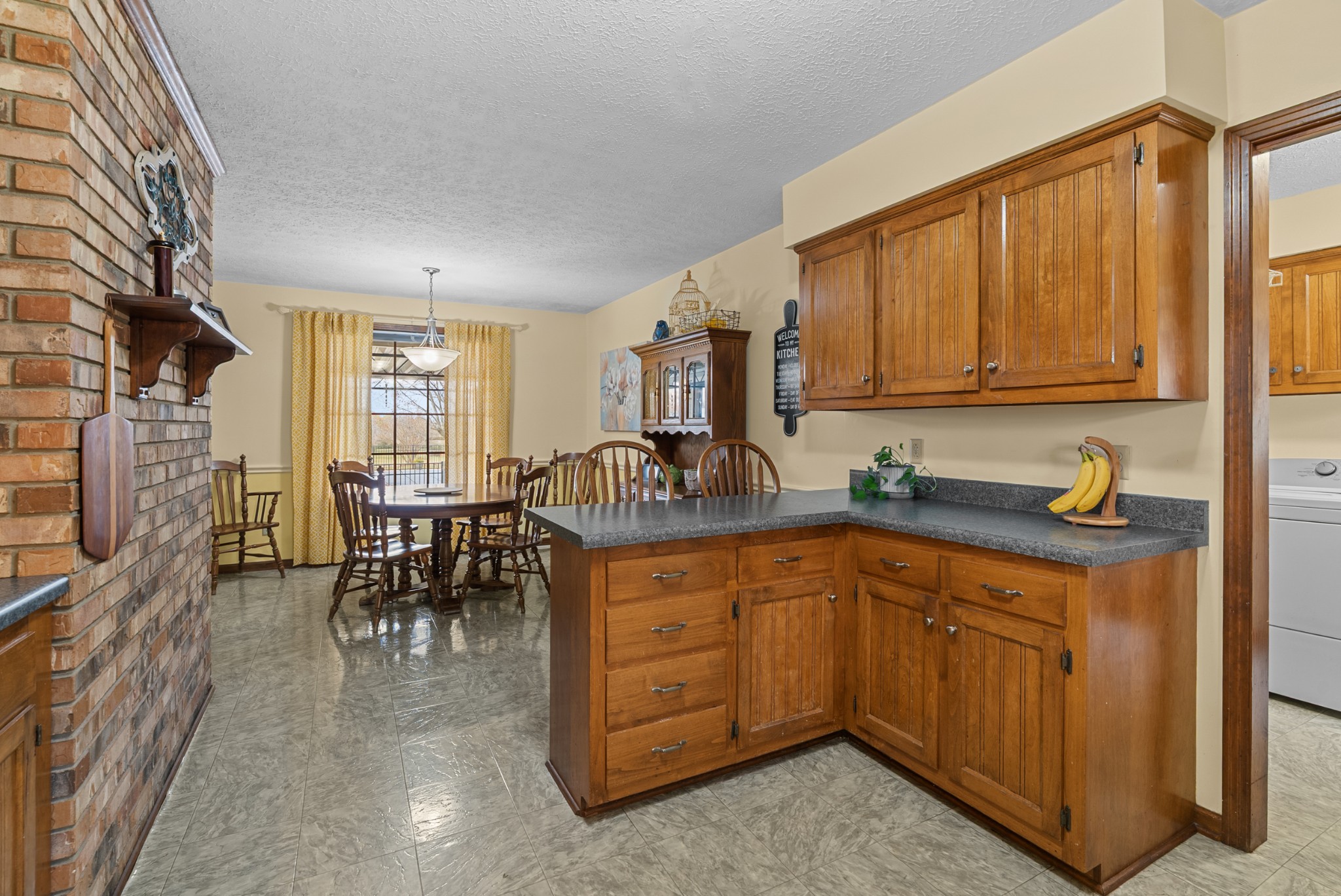 6980 Bethel Road Greenbrier, TN 37073 - Photo 20 of 51 a kitchen with lots of counter top space and dining table
