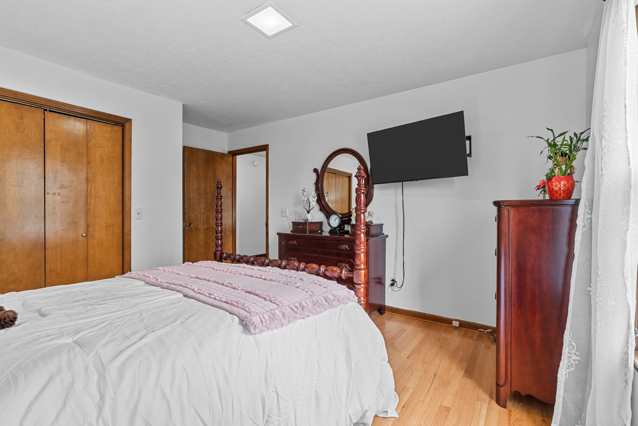 6980 Bethel Road Greenbrier, TN 37073 - Photo 23 of 51 a bedroom with a bed and a dresser with mirror