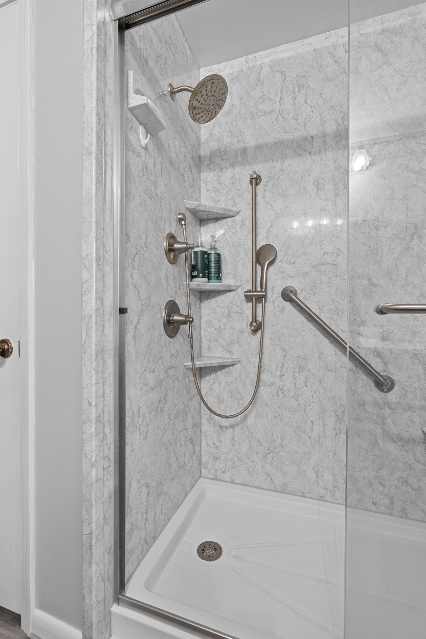 6980 Bethel Road Greenbrier, TN 37073 - Photo 25 of 51 a bathroom with a glass shower door
