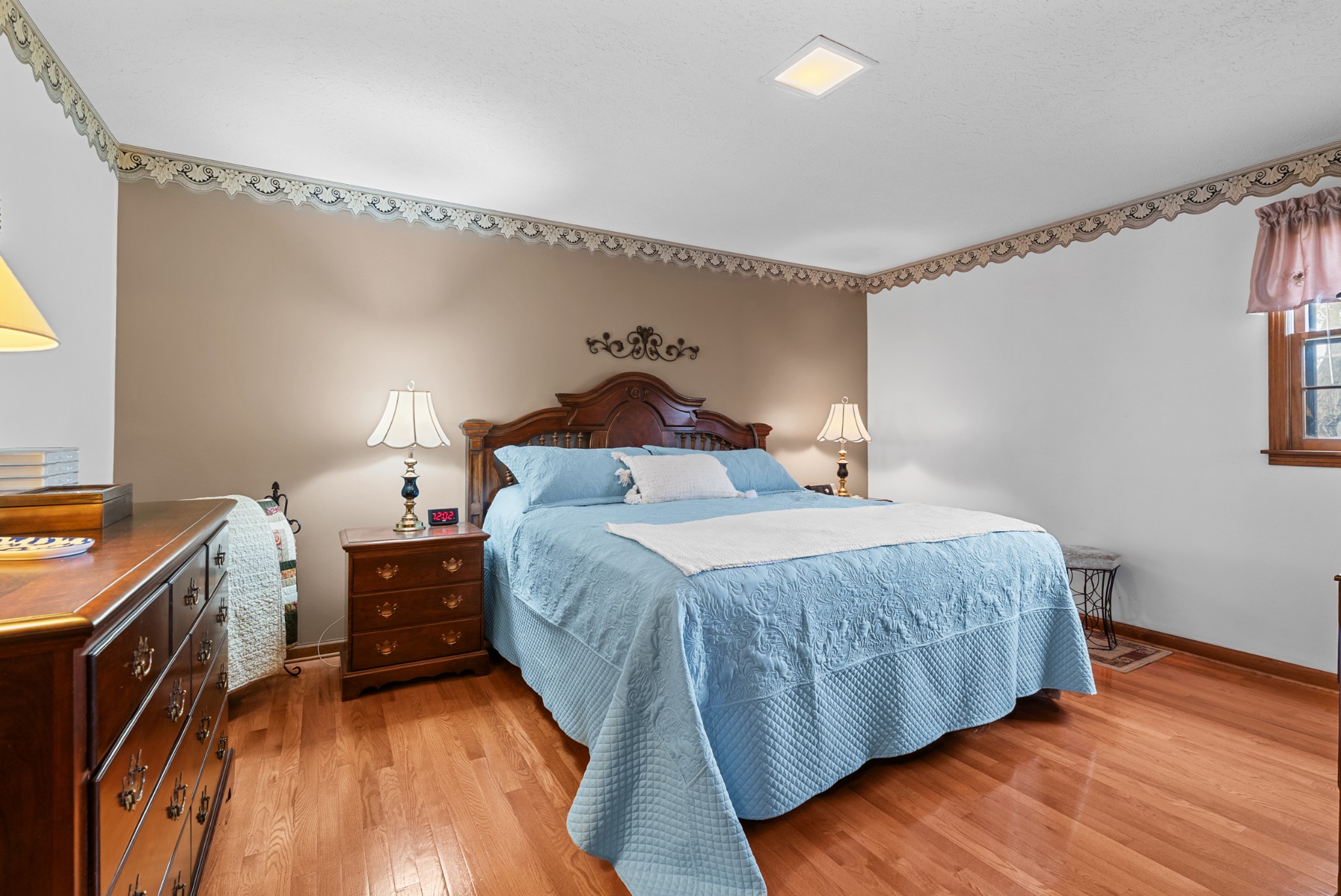 6980 Bethel Road Greenbrier, TN 37073 - Photo 26 of 51 a bedroom with a bed and a flat tv screen on the dresser