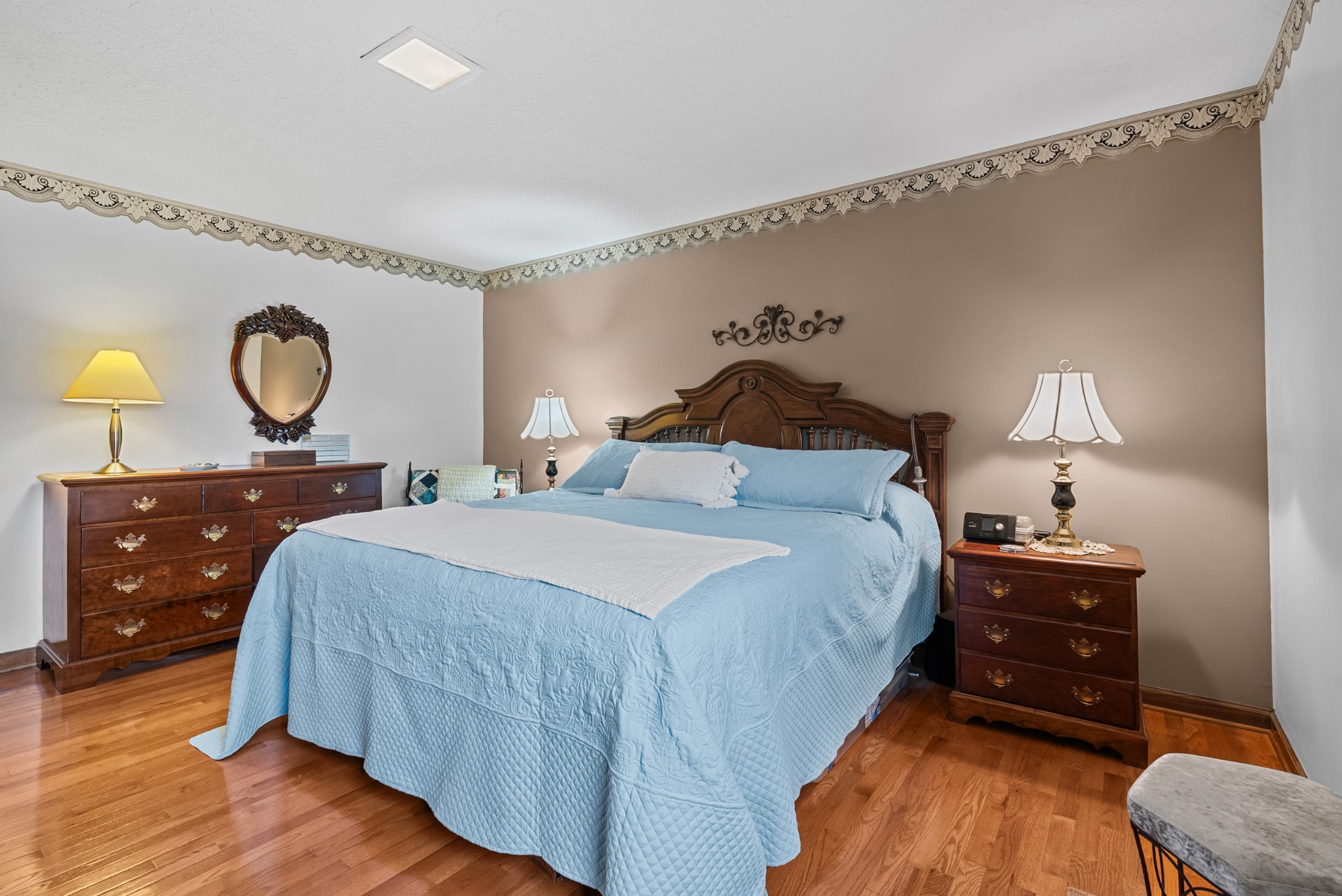 6980 Bethel Road Greenbrier, TN 37073 - Photo 27 of 51 a bedroom with a bed and a chandelier