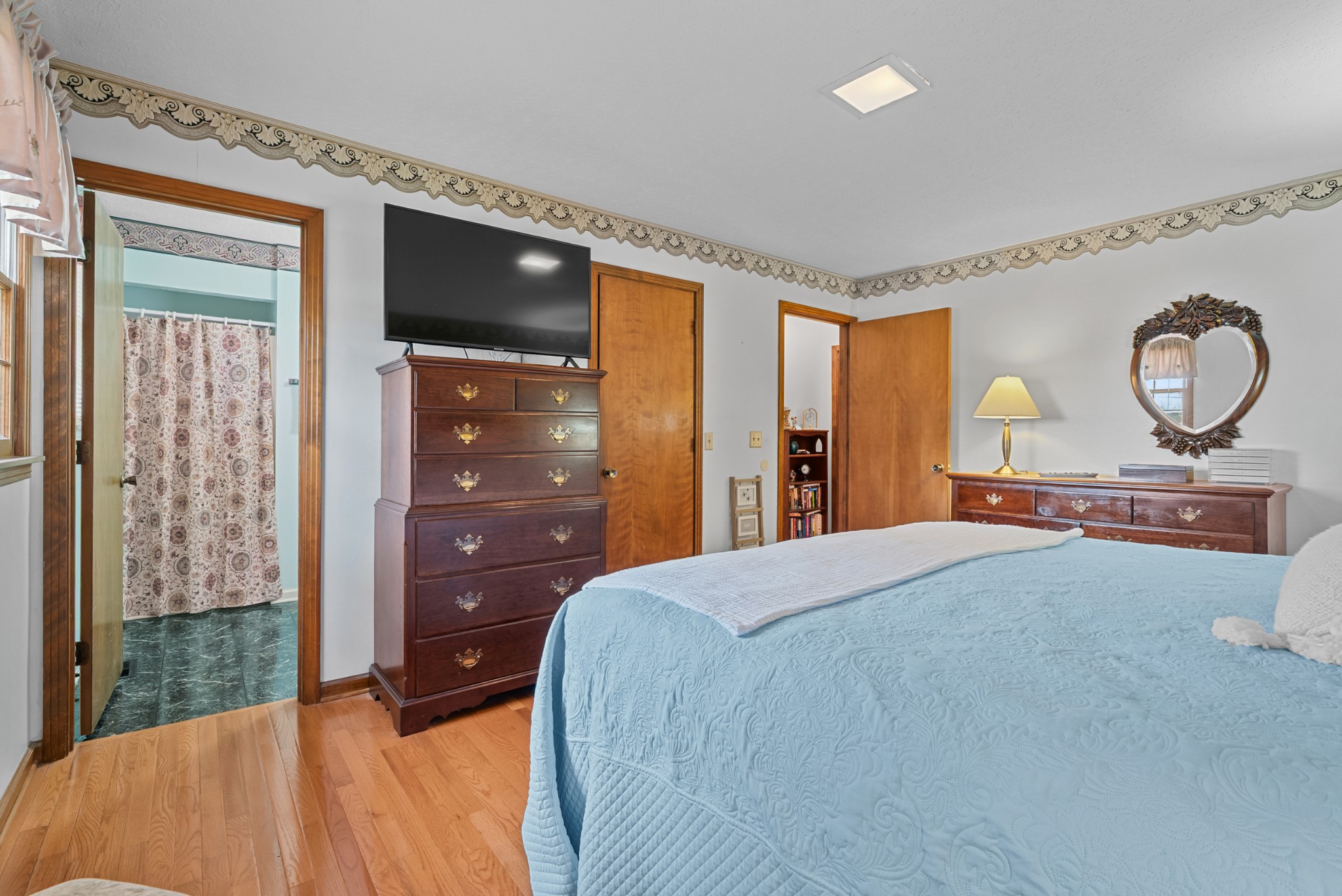 6980 Bethel Road Greenbrier, TN 37073 - Photo 28 of 51 a bedroom with a bed and a dresser next to a window