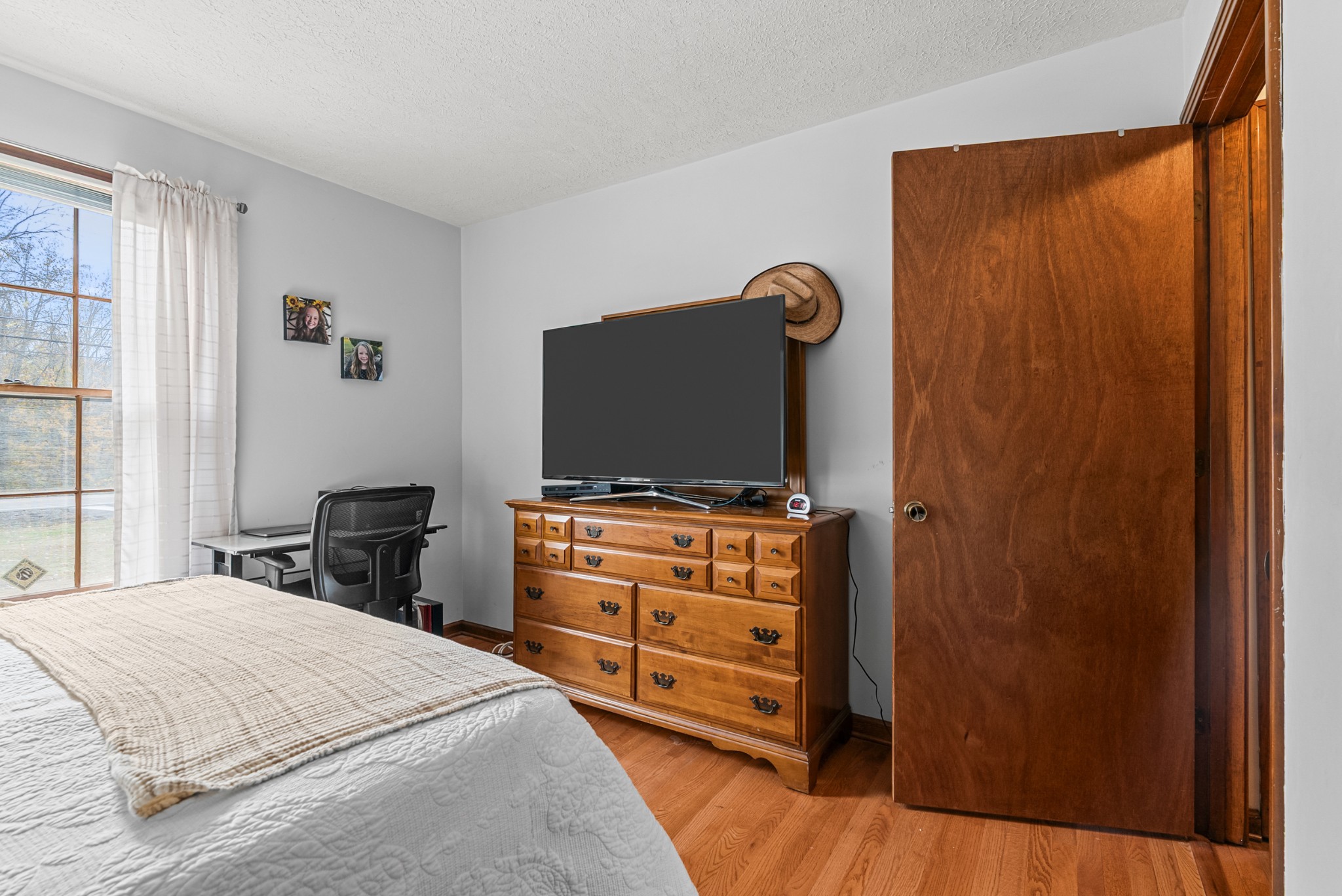 6980 Bethel Road Greenbrier, TN 37073 - Photo 31 of 51 a bedroom with a bed and a flat screen tv