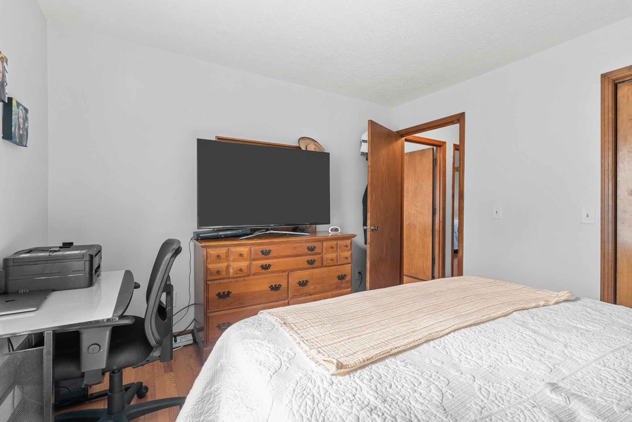 6980 Bethel Road Greenbrier, TN 37073 - Photo 32 of 51 a bedroom with a bed and a flat screen tv