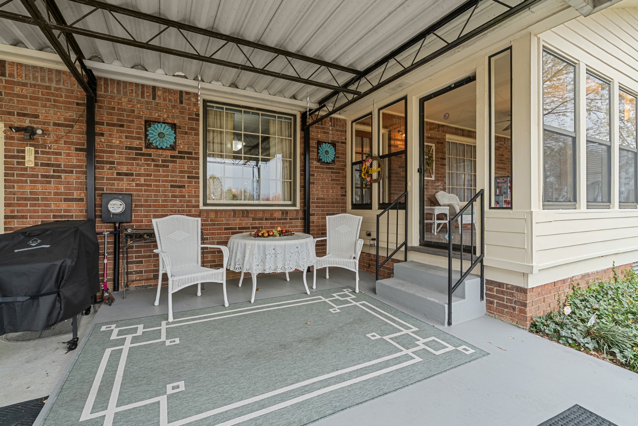 6980 Bethel Road Greenbrier, TN 37073 - Photo 40 of 51 a view of a patio with table and chairs and potted plants