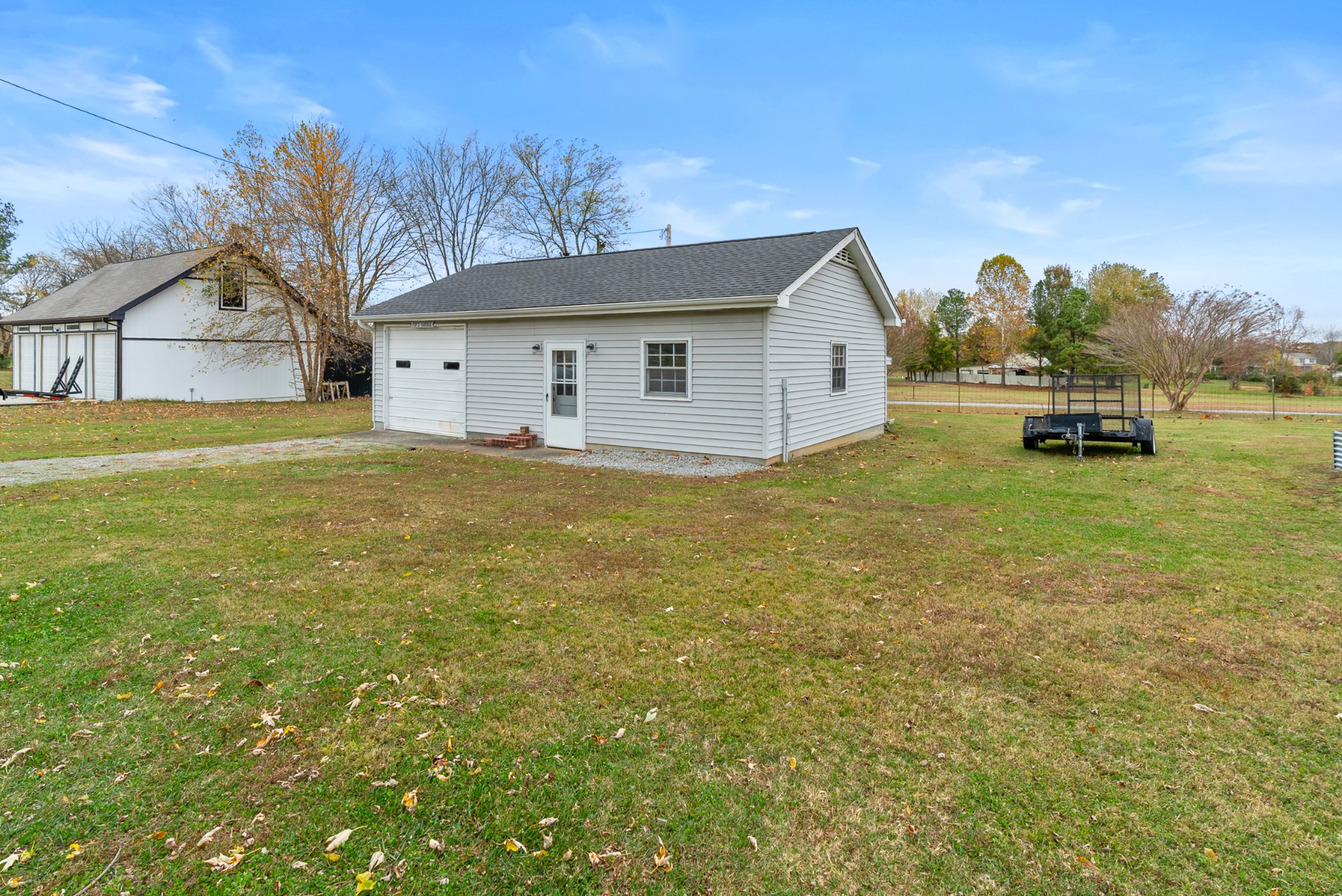 6980 Bethel Road Greenbrier, TN 37073 - Photo 46 of 51 a view of a house with a yard and sitting area