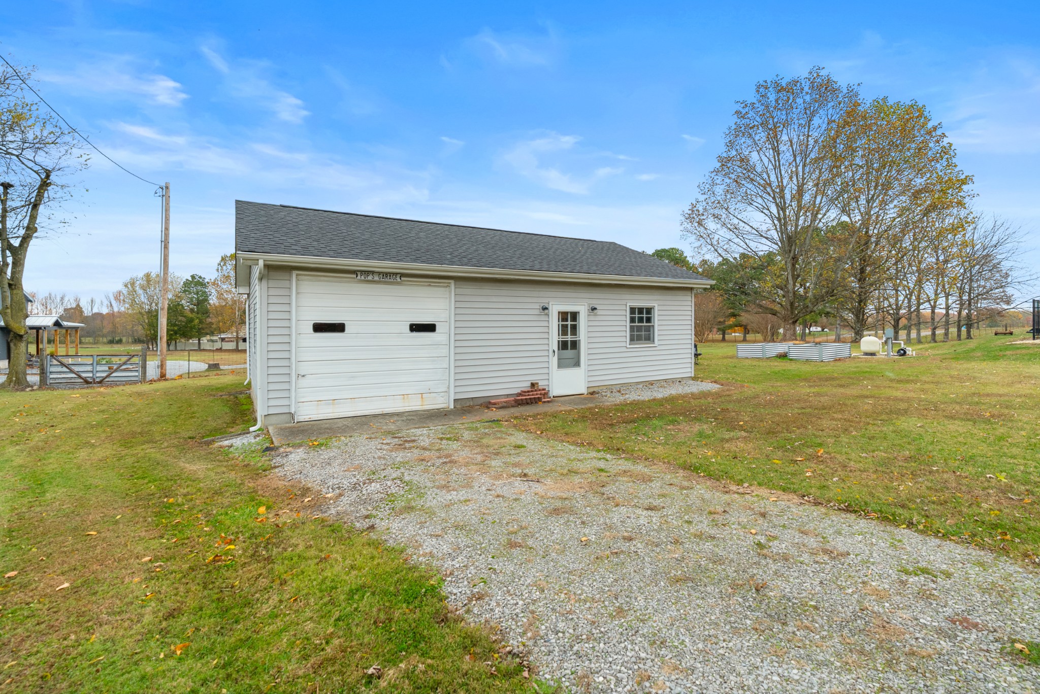 6980 Bethel Road Greenbrier, TN 37073 - Photo 47 of 51 a view of a house with backyard and trees